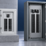 Side-by-side comparison of a compact load center and a larger commercial panelboard