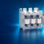 SUTON ETGLR three-fuse switch-disconnector: disconnected product on a dark editorial background