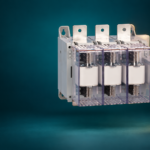 SUTON ETGLR three-fuse switch-disconnector: disconnected product on a dark editorial background