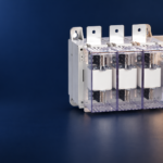 SUTON ETGLR three-fuse switch-disconnector: disconnected product on a dark editorial background