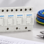 SUTON ETU1 four-module surge protective device, disconnected product on a specification review desk