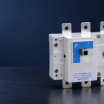 SUTON ETGL(HGL) three-pole switch-disconnector: disconnected product on a dark editorial background