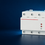 SUTON DZ47-125V1 automatic-reset voltage protector family: disconnected product on a dark editorial background